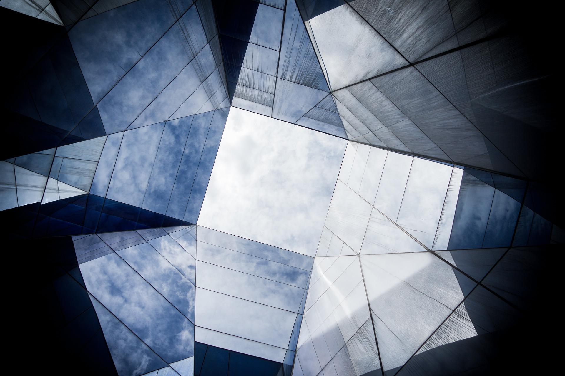 The top of a building made up of unusual shapes